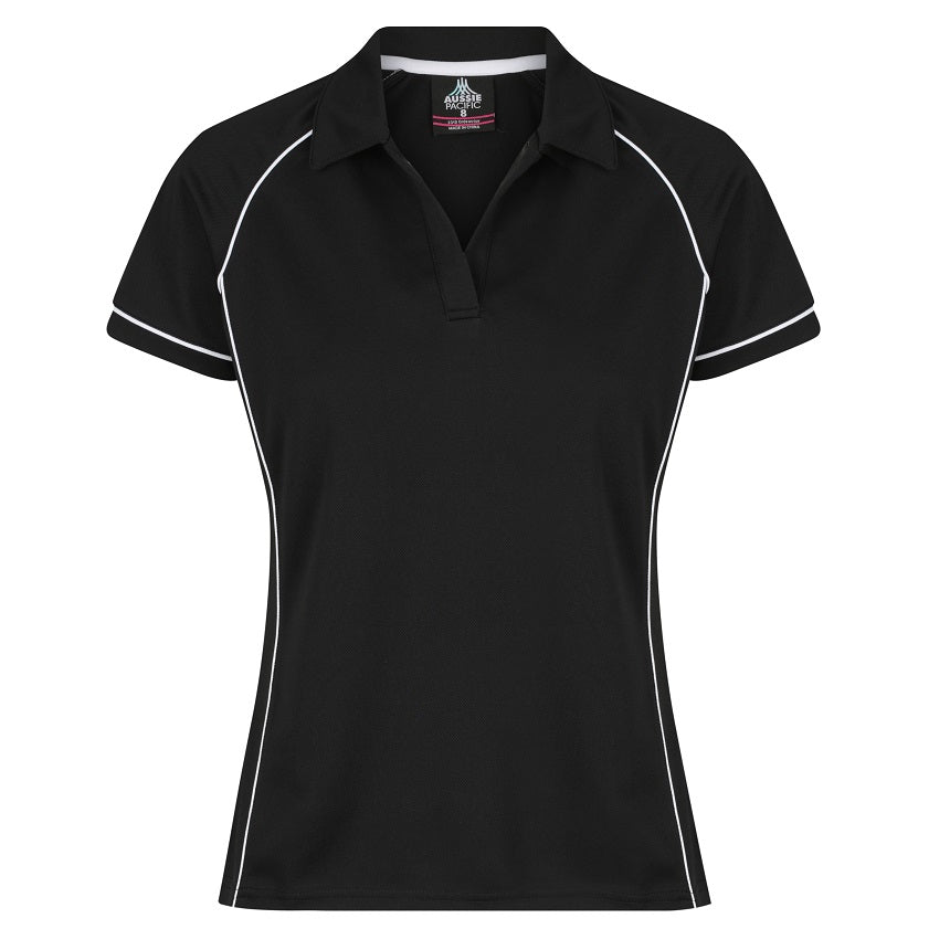 A black and white Aussie Pacific Endeavour ladies polo shirt with contrast piping at the raglan, side panel, and sleeve cuff, displayed on a plain background.