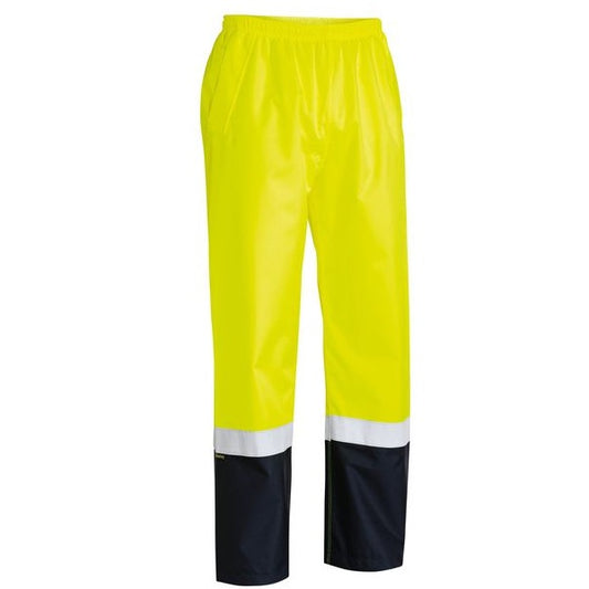 A pair of yellow and orange Bisley branded rain pants with reflective tape around the lower leg and a full elasticated waistband.