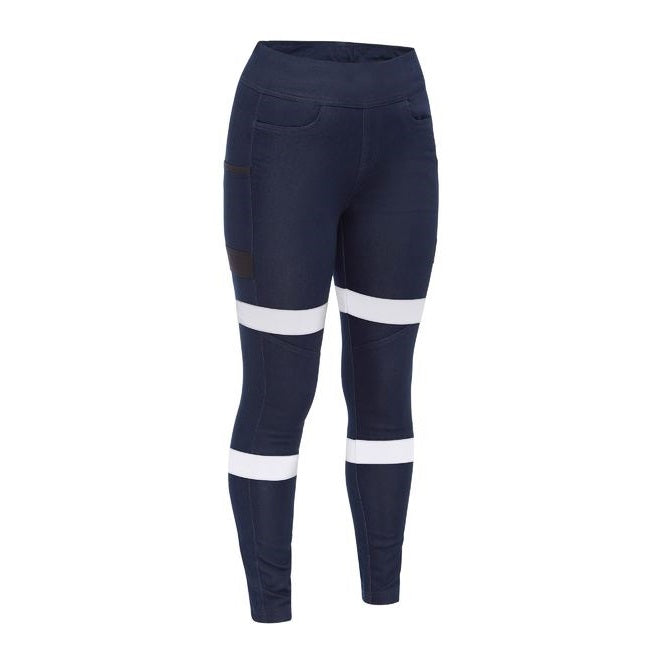 A pair of navy-colored Bisley women's jeggings with white reflective biomotion tape and functional front pockets.