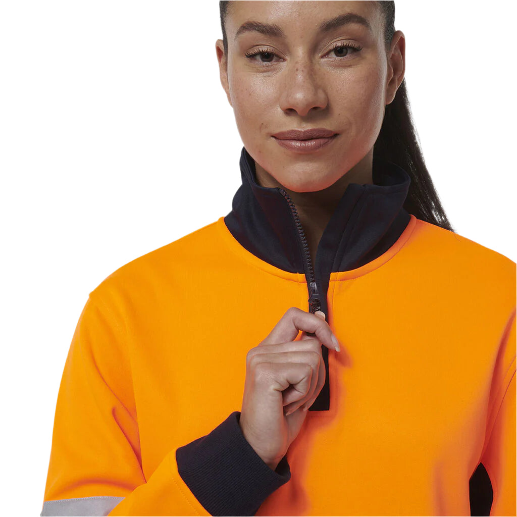 Person wearing an orange high-visibility jacket with a black zipper on a white background