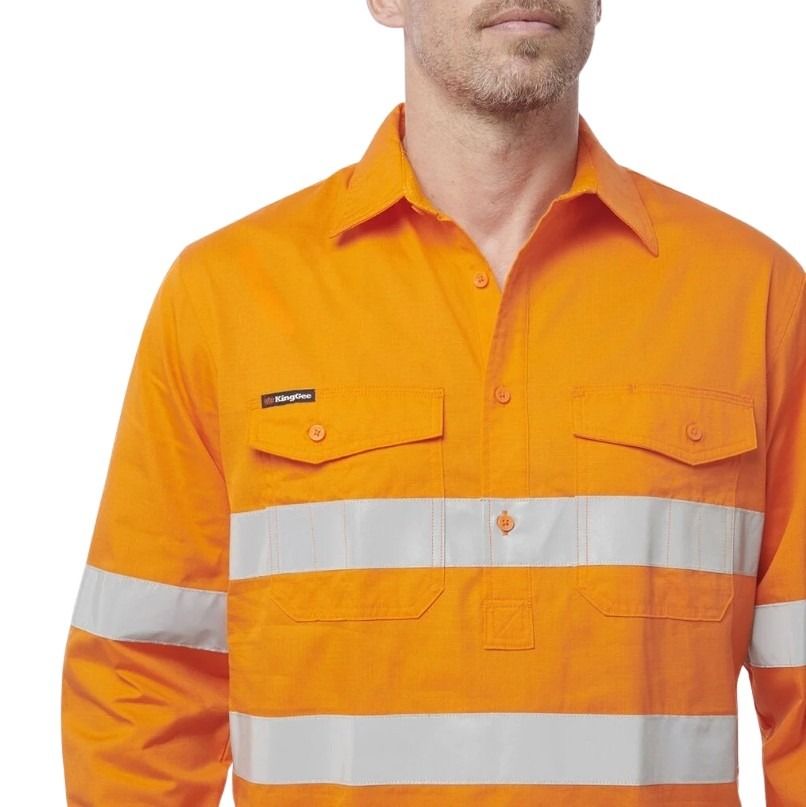 Orange work shirt with reflective stripes on a white background