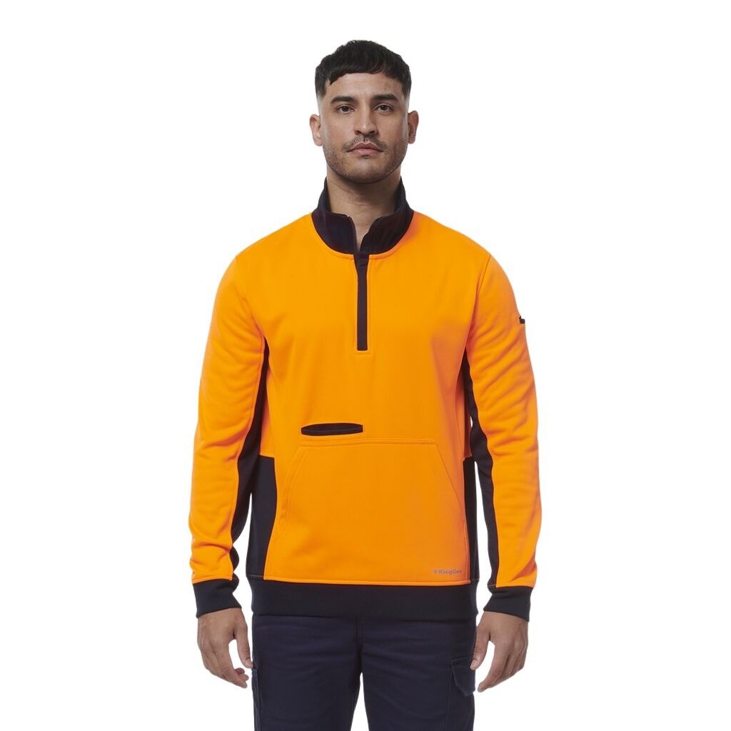 Man wearing an orange and black sweatshirt on a white background