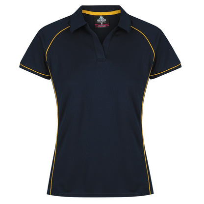 A navy blue and gold colored Aussie Pacific Endeavour ladies polo shirt with contrast piping at the raglan, side panel, and sleeve cuff.