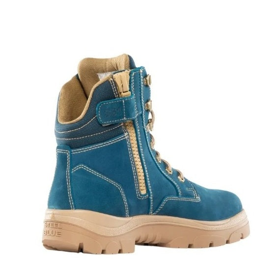 Blue boot with beige accents on a white background