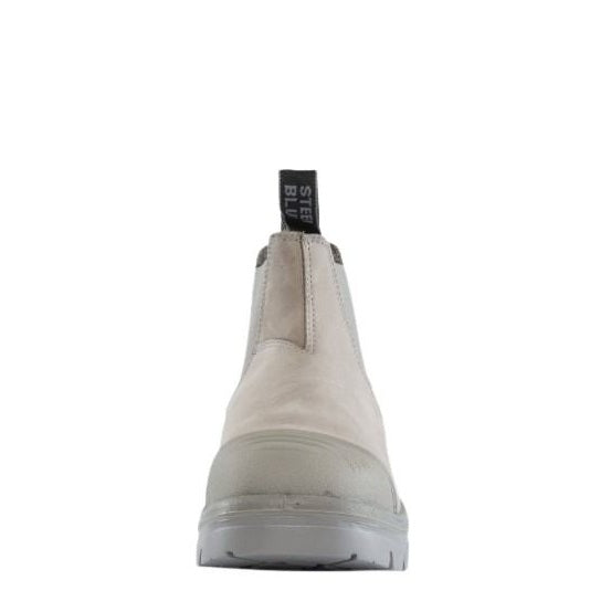 White Chelsea boot with a visible brand label on a white background