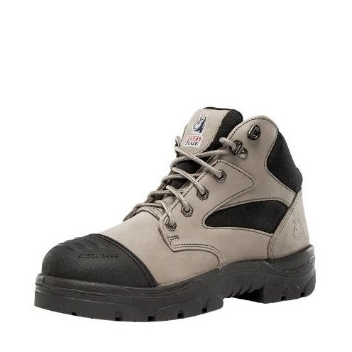 Tan and black work boot on a white background