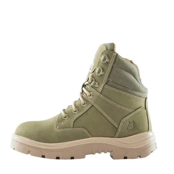 Green hiking boot with a white sole on a white background