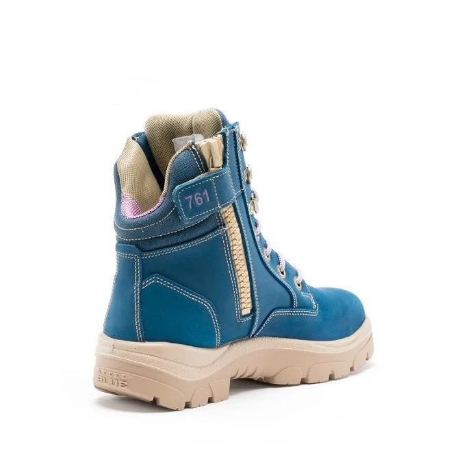 Blue hiking boot with beige accents on a white background