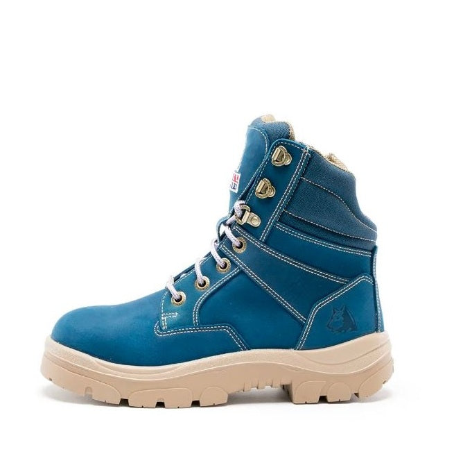 Blue work boot with beige sole on a white background