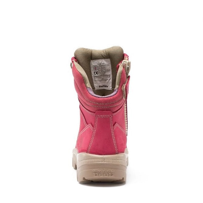 Pink boot with beige sole on a white background
