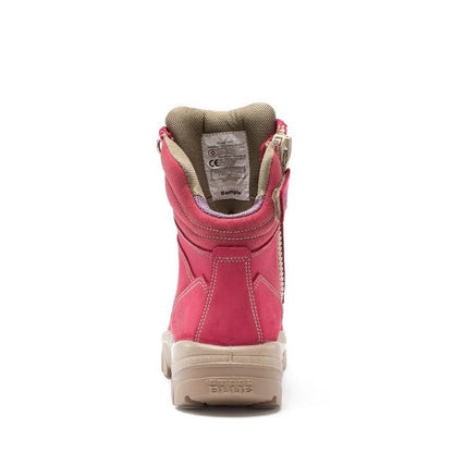 Pink boot with beige sole on a white background