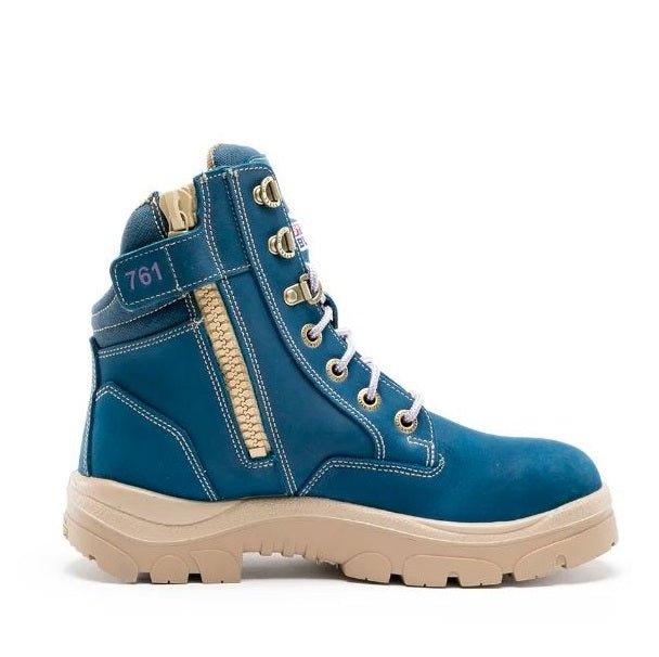 Blue work boot with beige accents on a white background