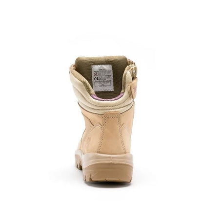 Beige boot with visible sole on a white background