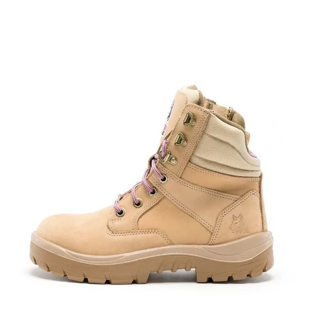 Beige hiking boot with pink laces on a white background