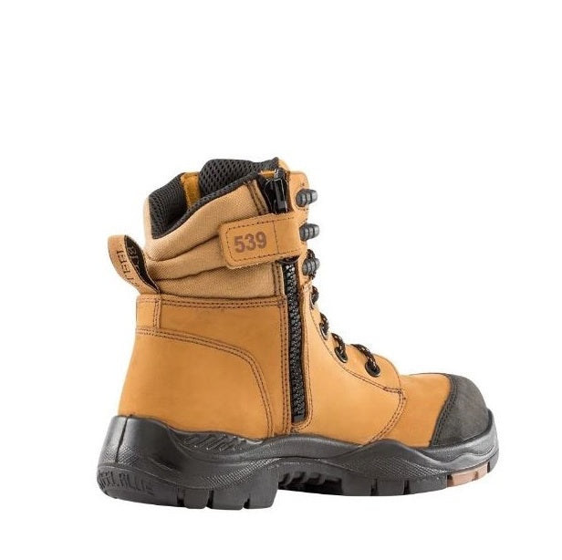 Tan work boot with black sole on a white background