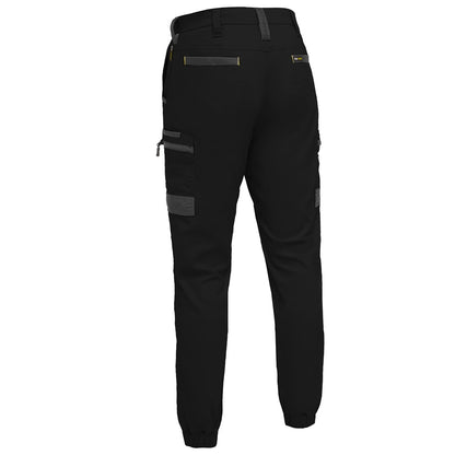 Black pants with zippers and pockets on a white background