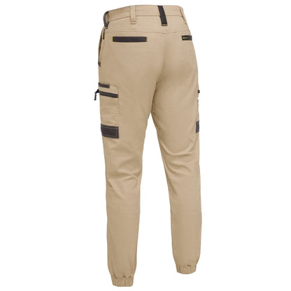 Beige cargo pants with black accents on a white background