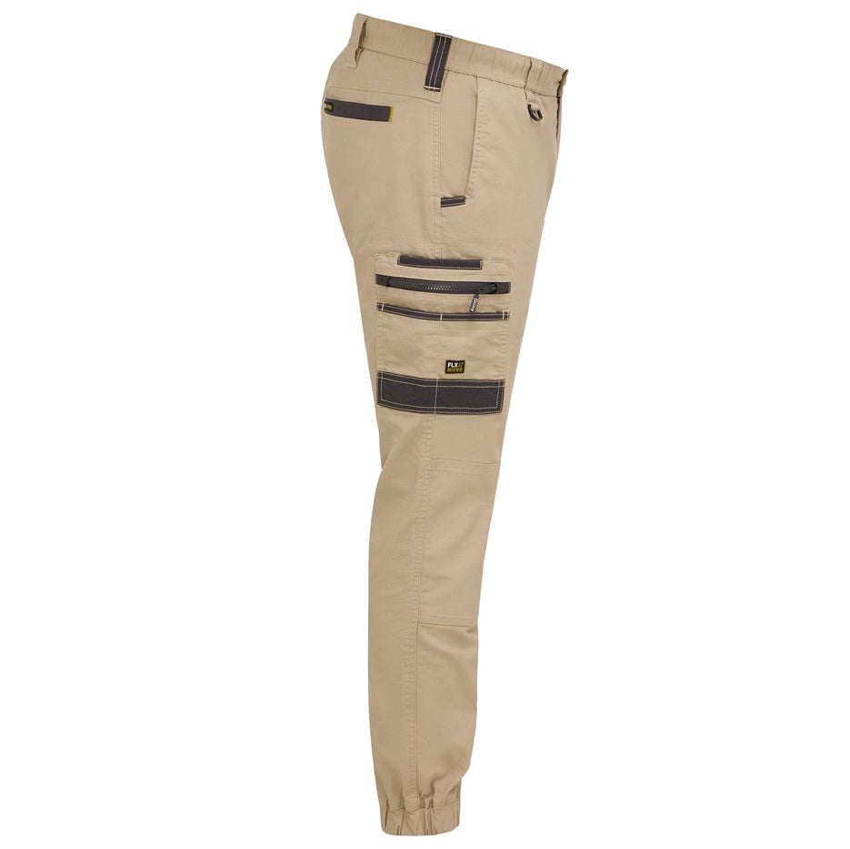 Beige pants with black zippers and pockets on a white background