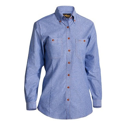 Blue denim shirt with brown buttons on a white background