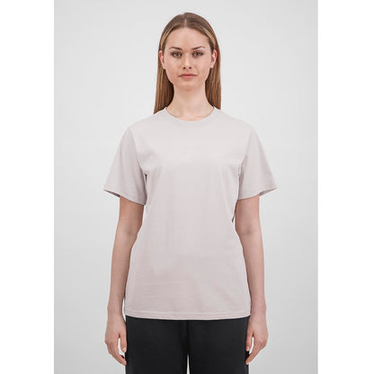 Person wearing a plain light gray t-shirt on a white background