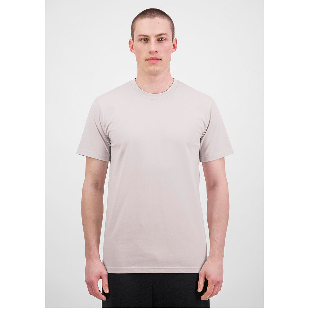 Man wearing a plain beige t-shirt on a white background