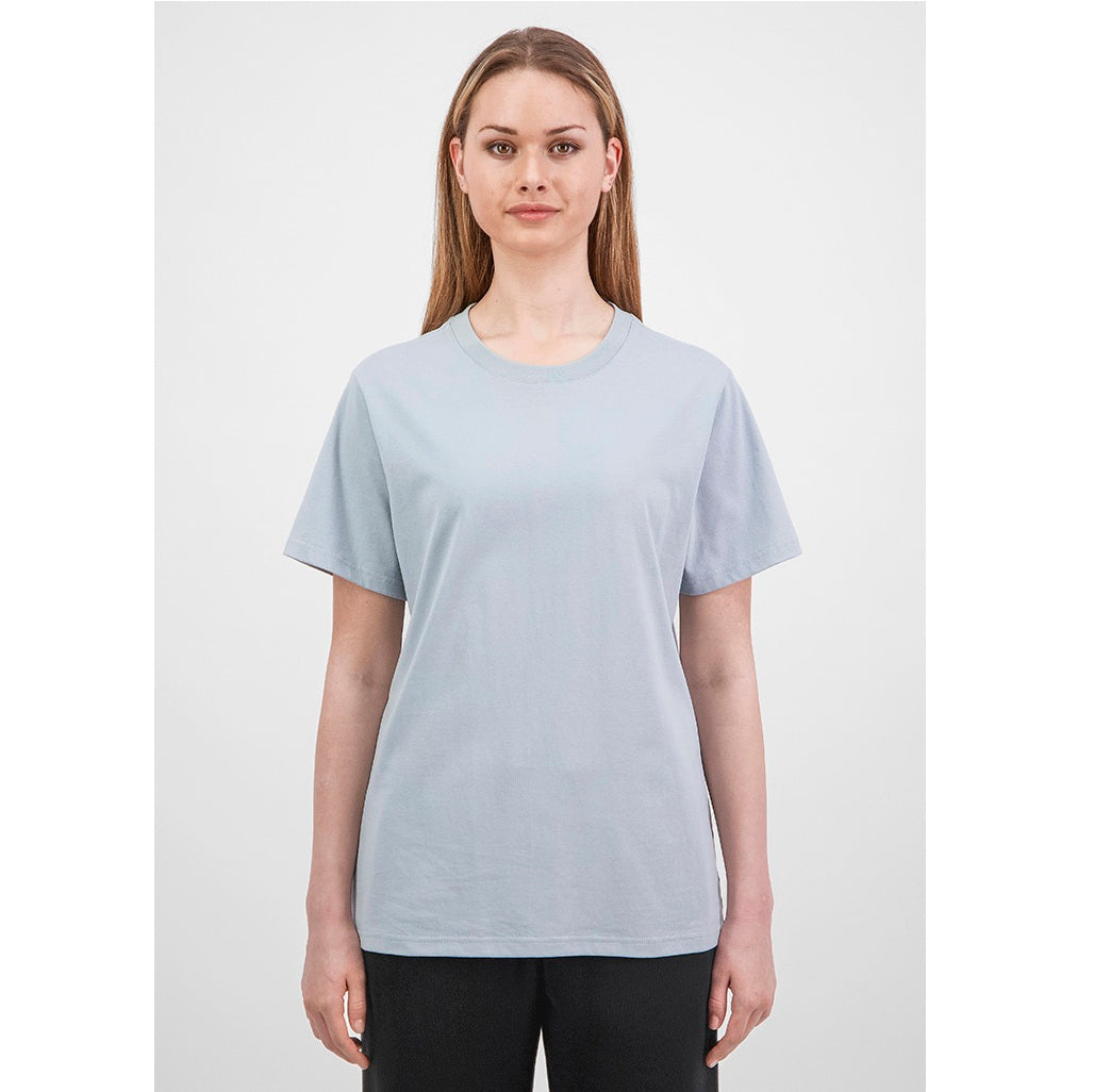 Woman wearing a light blue t-shirt on a white background