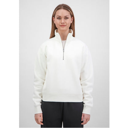 Woman wearing a white half-zip sweatshirt on a light gray background