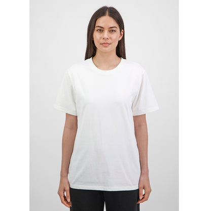 Woman wearing a white t-shirt against a plain background