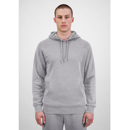 Person wearing a gray hoodie on a white background