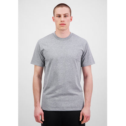 Man wearing a plain gray t-shirt against a white background
