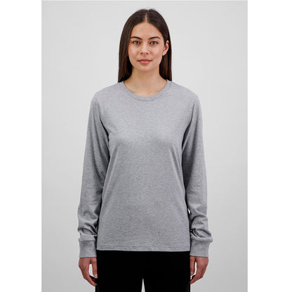 Woman wearing a gray long-sleeve shirt against a plain background