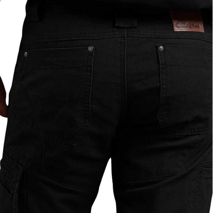 Close-up of black cargo pants with a brand label on a white background