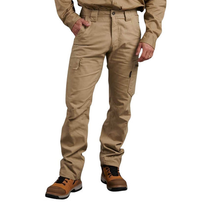 Person wearing beige work pants and brown boots on a white background