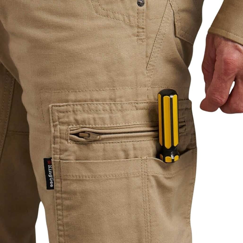 Person wearing beige pants with a tool belt featuring a yellow and black tool.