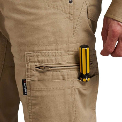 Person wearing beige pants with a tool belt featuring a yellow and black tool.