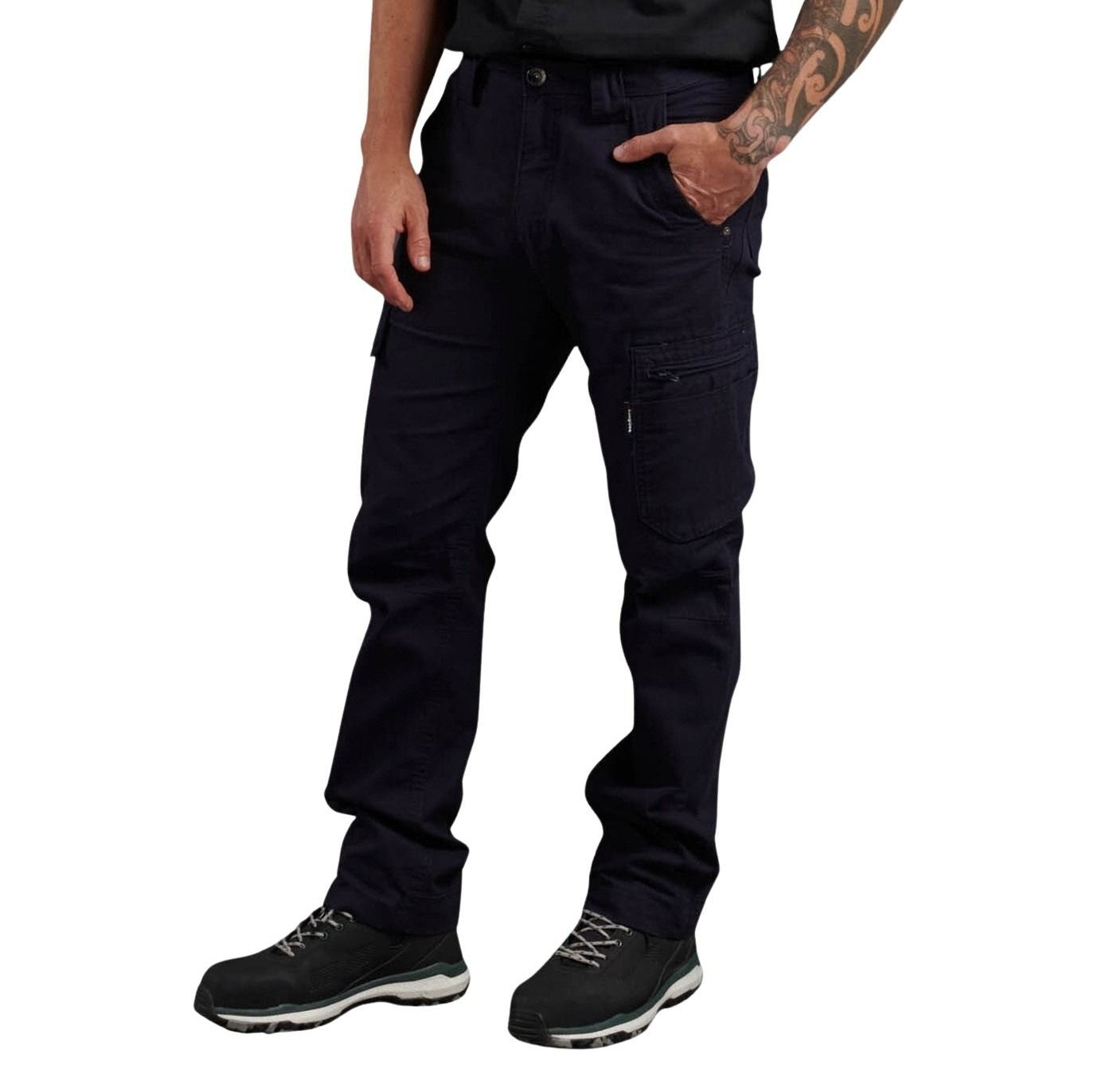 Person wearing dark blue cargo pants on a white background