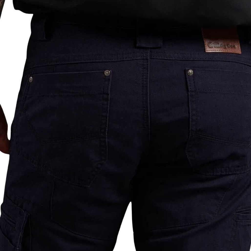 Close-up of dark blue pants with a brand label on a white background