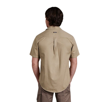 Person wearing a beige short-sleeve shirt on a white background