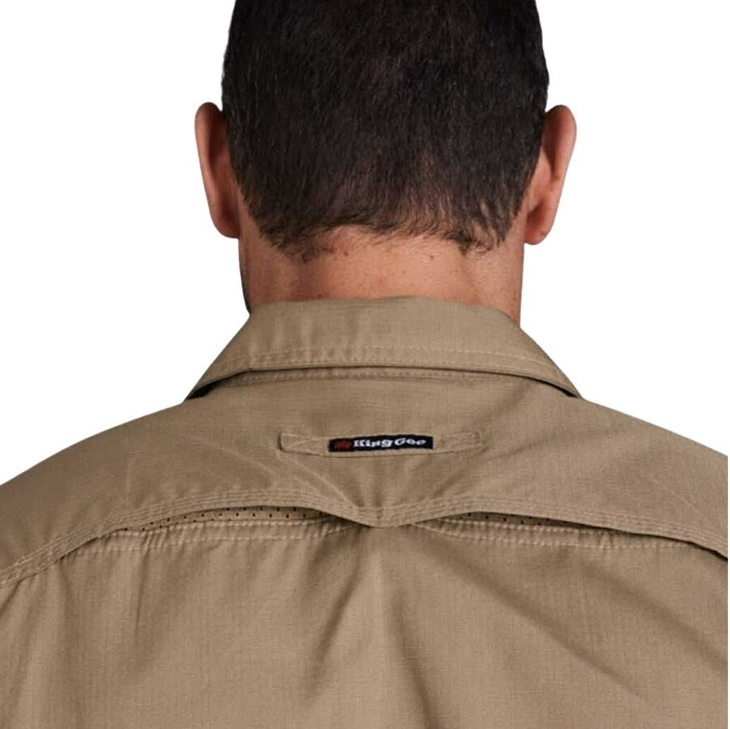 Back view of a person wearing a beige shirt with a King Gee logo on a white background