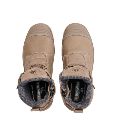 Pair of beige boots with King Gee branding on a white background