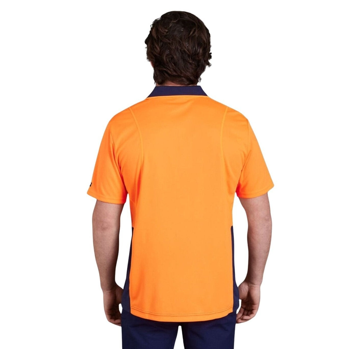 man wearing orange and navy polo on white background