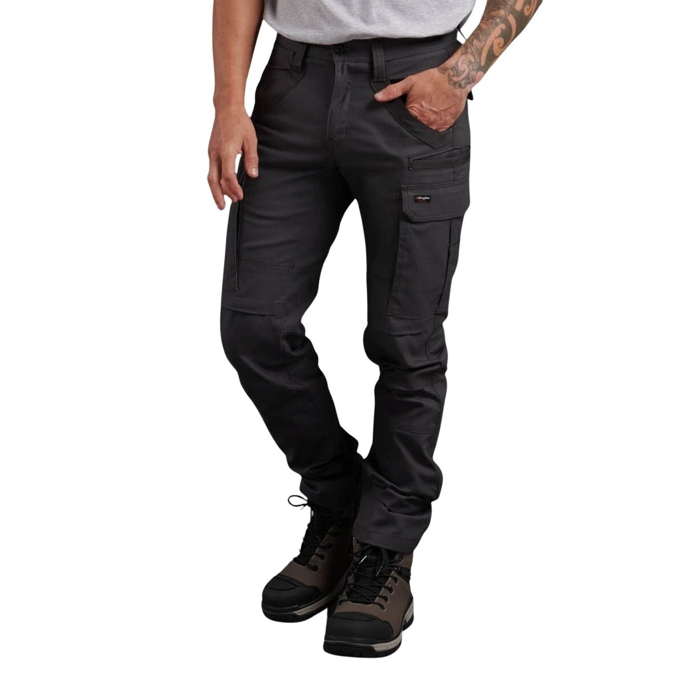 Person wearing black cargo pants on a white background