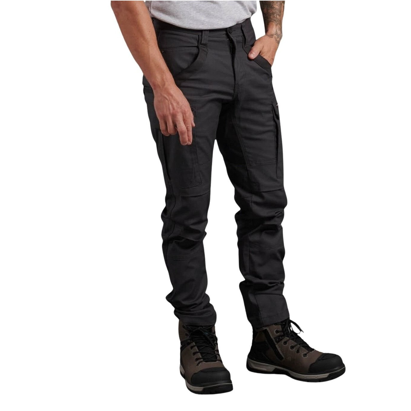 Person wearing dark gray pants and black boots on a white background