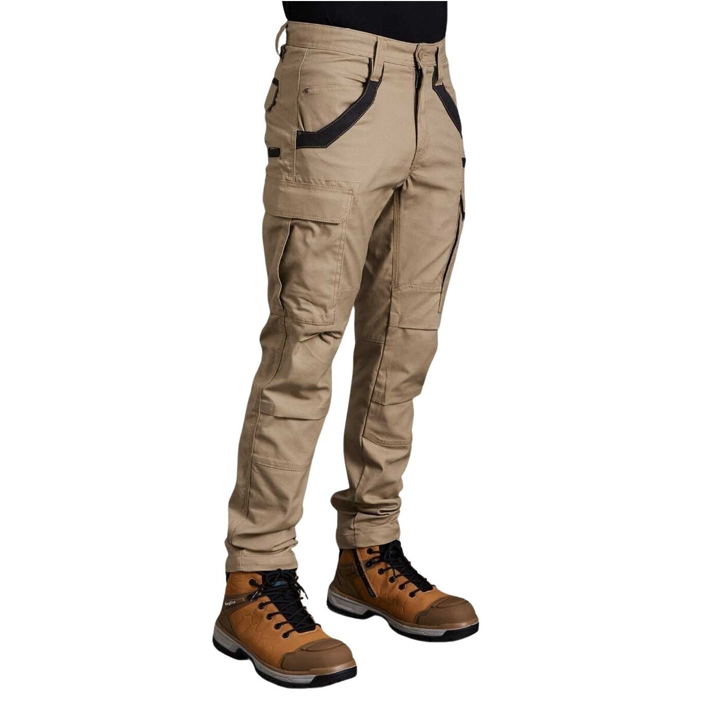 Khaki pants with black accents worn with brown boots on a white background