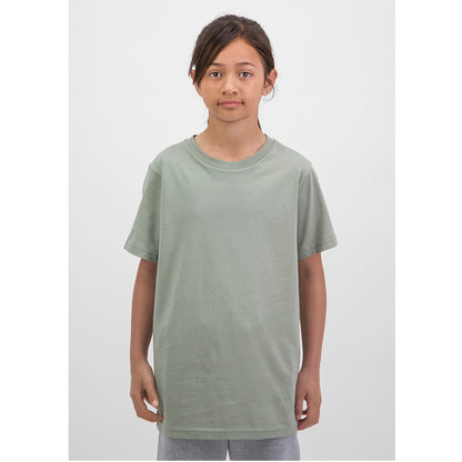 Child wearing a plain green t-shirt on a white background