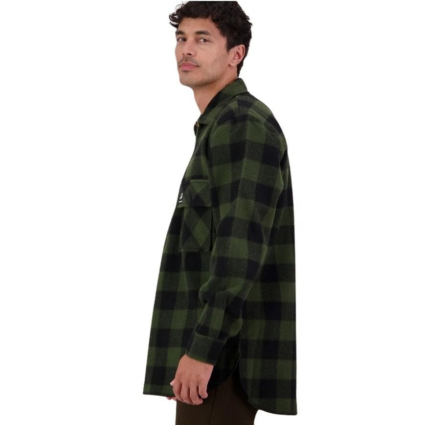 Man wearing a green and black checkered shirt on a white background