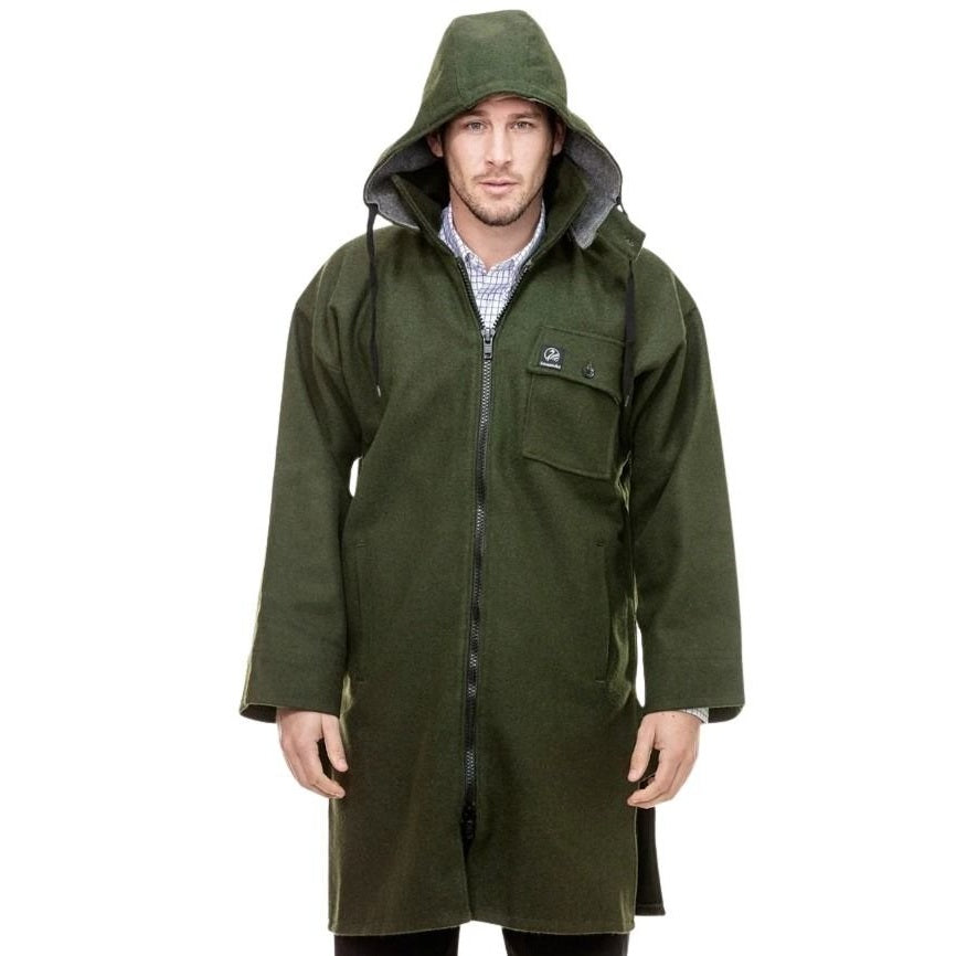 Man wearing a green raincoat on a white background