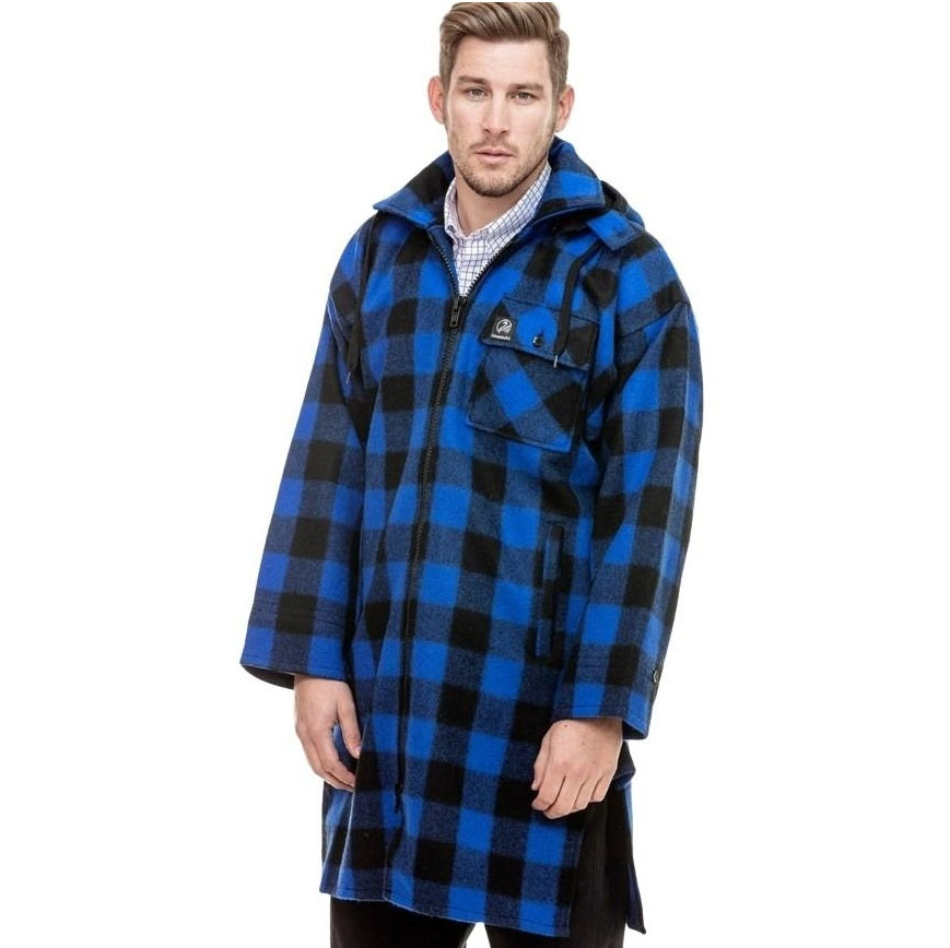 Man wearing a blue and black checkered coat on a white background