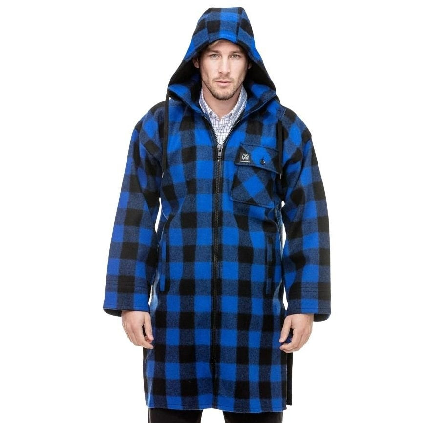 Man wearing a blue and black checkered coat on a white background