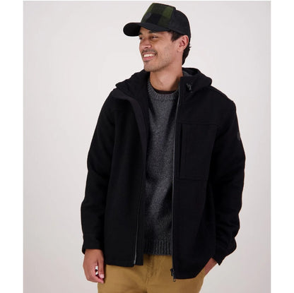 Man wearing a black jacket, gray sweater, and green cap on a white background